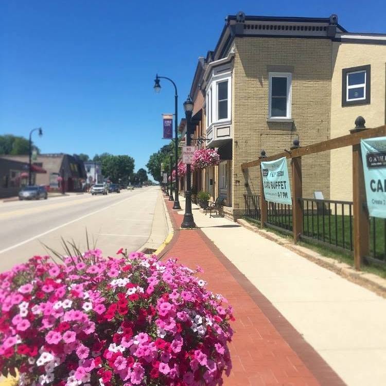 Waunakee's charming main street with flower-lined sidewalks, a familiar setting for an outing
